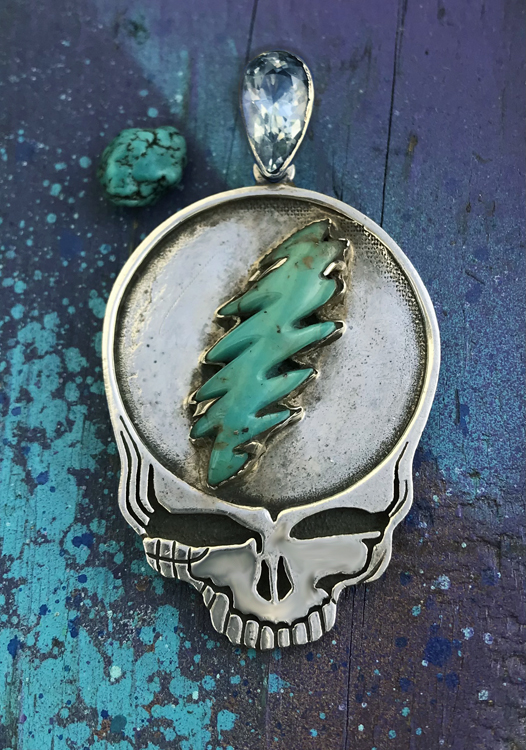 turquoise carved bolt steal your face necklace